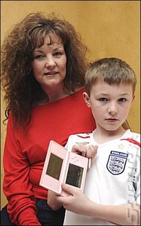 Mother, son and pink DS. (pic via News of the World) Mother, son and pink DS. (pic via News of the World)